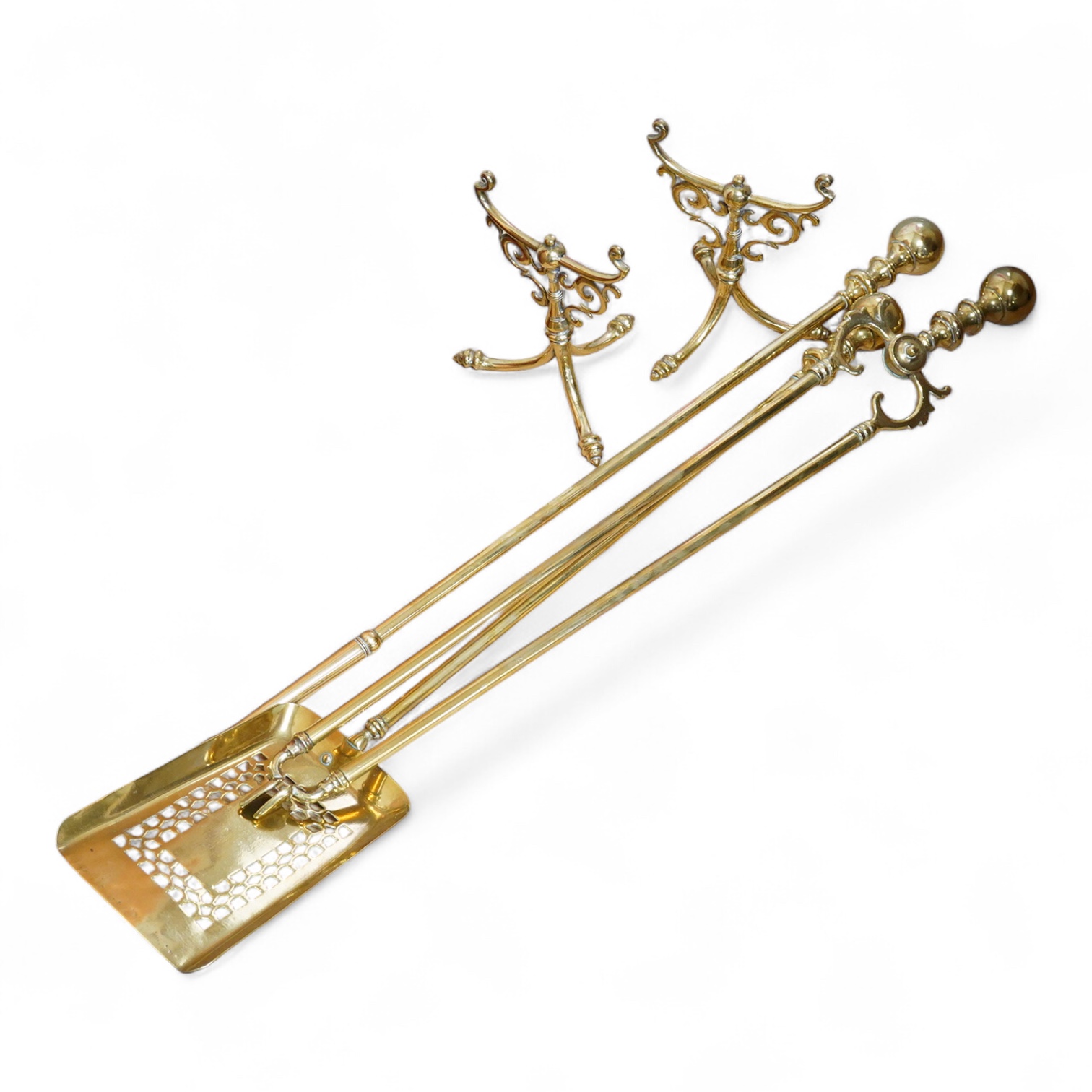 Three brass andirons and two trivets